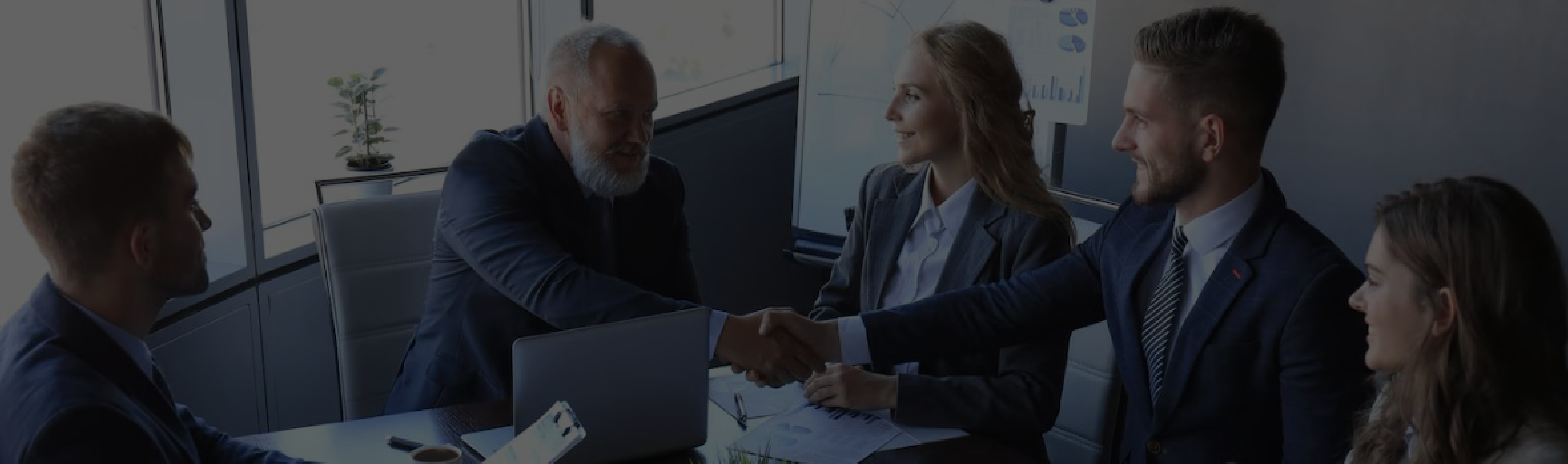 Business meeting with people discussing property map on a wall
